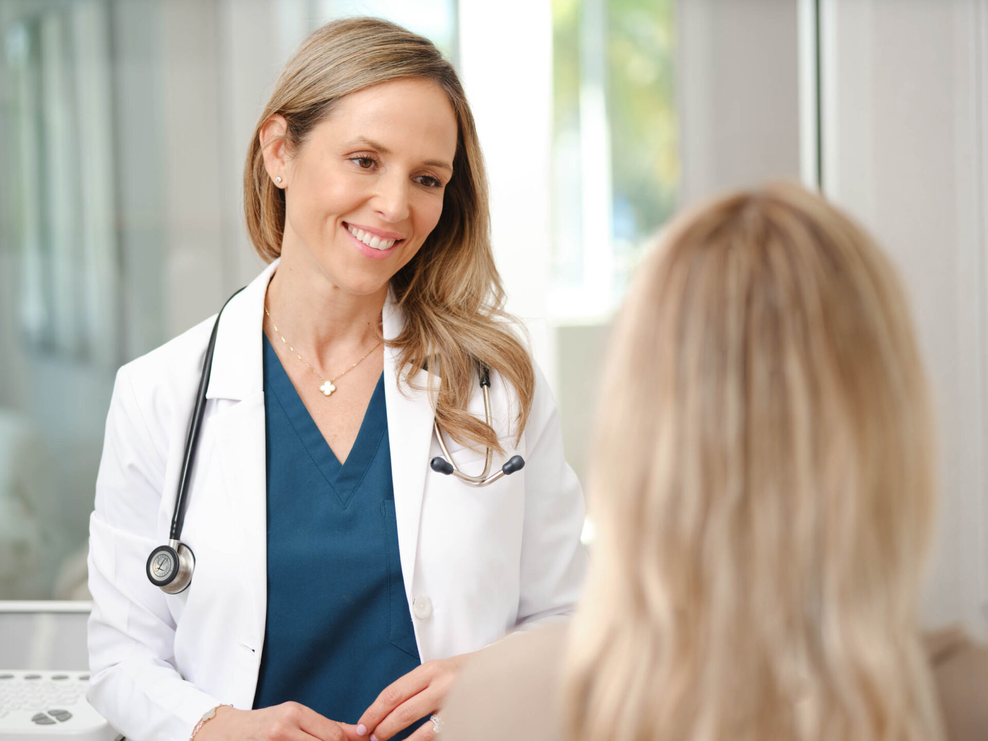 Dr. Kristen Doddo talking to a patient at Core Health and Wellness
