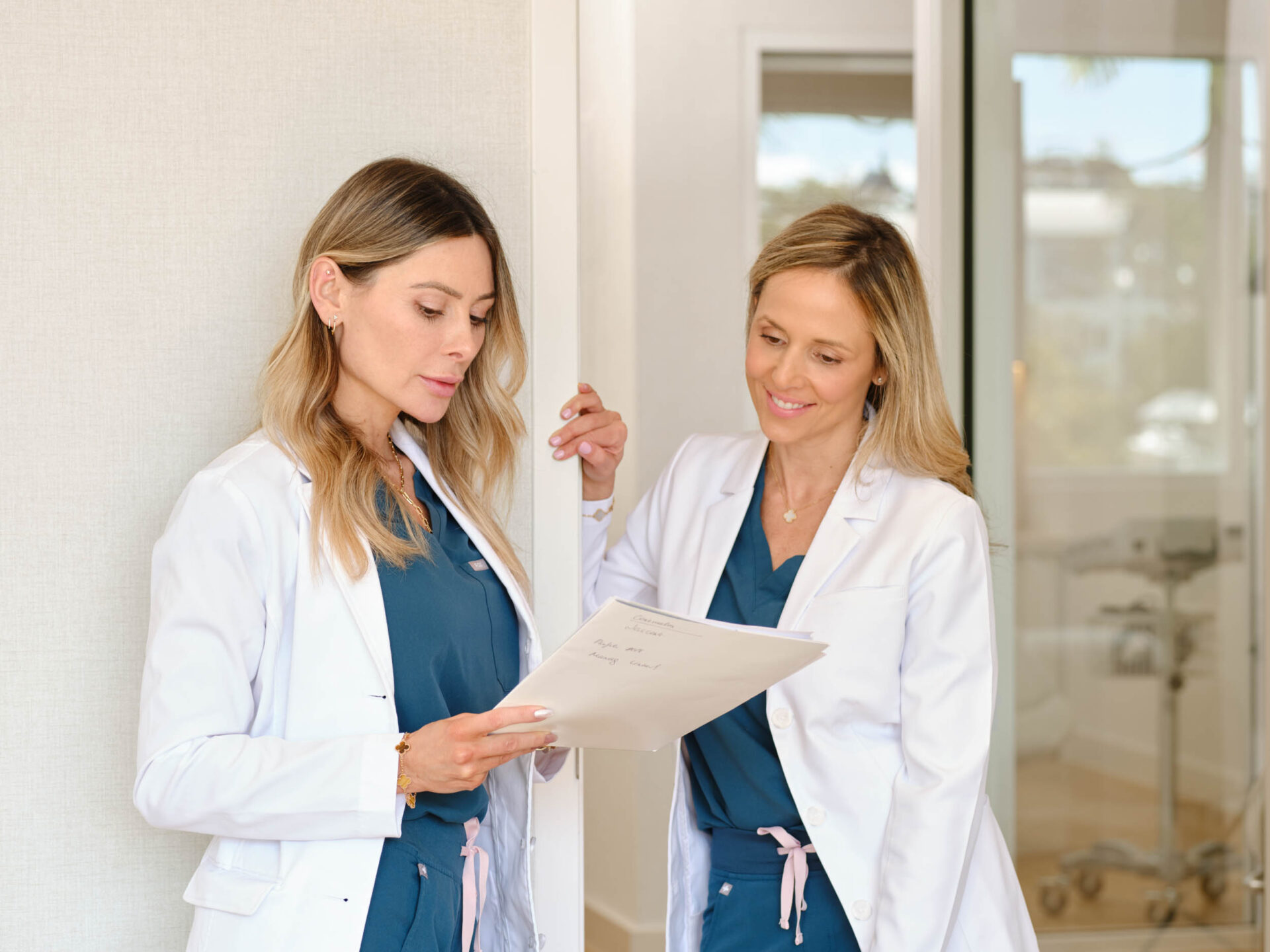 Two Doctors discussing a file.